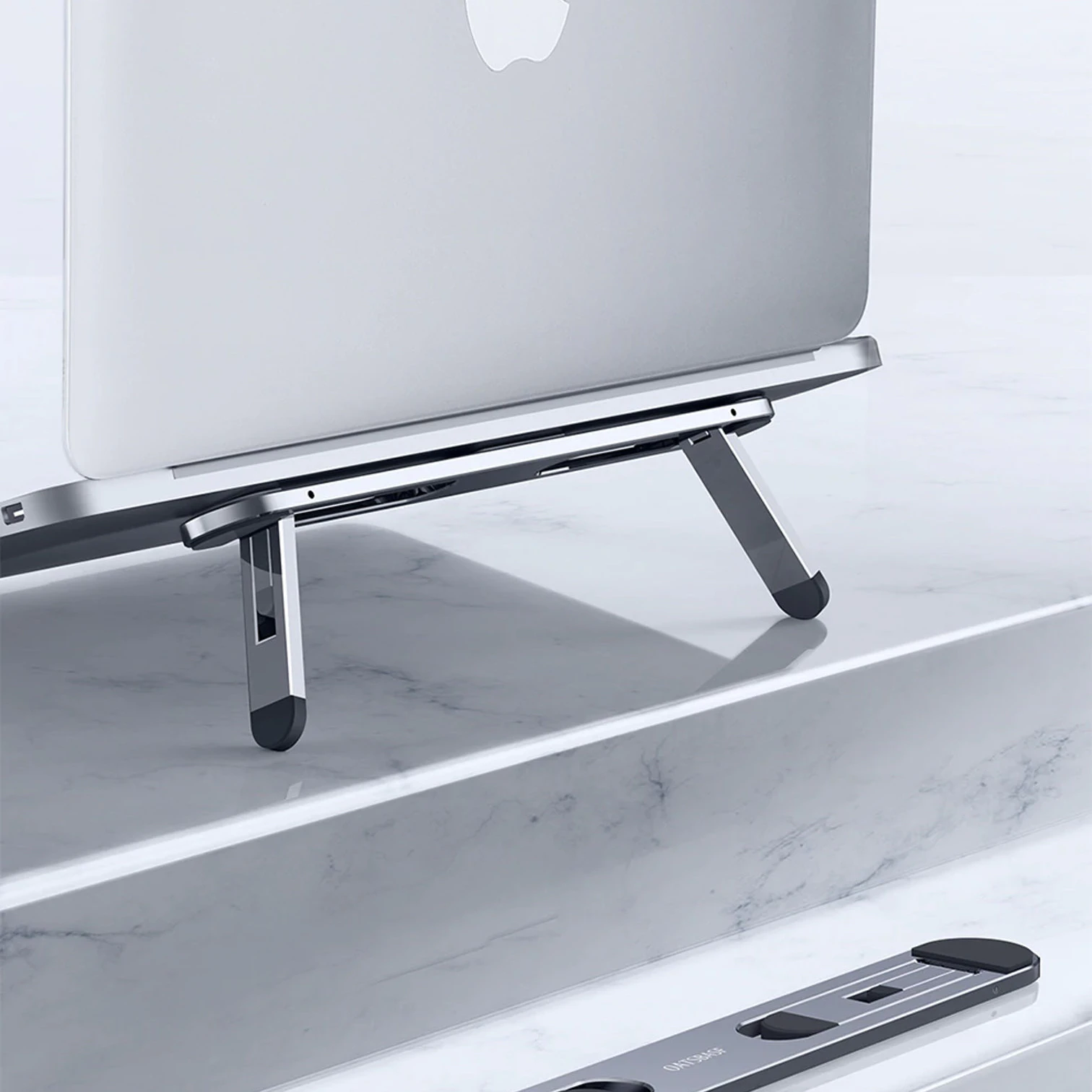 ultra-portable-laptop-riser-ILkIq0vJ51DzhiWgxNzl.png